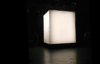 white cube in dark room
